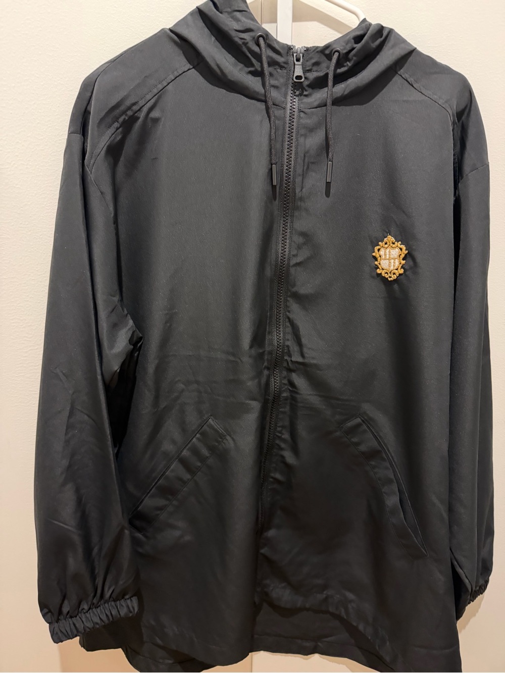 Calvin Klein Black Hooded Zip Windbreaker with added Gold Crest Patch used